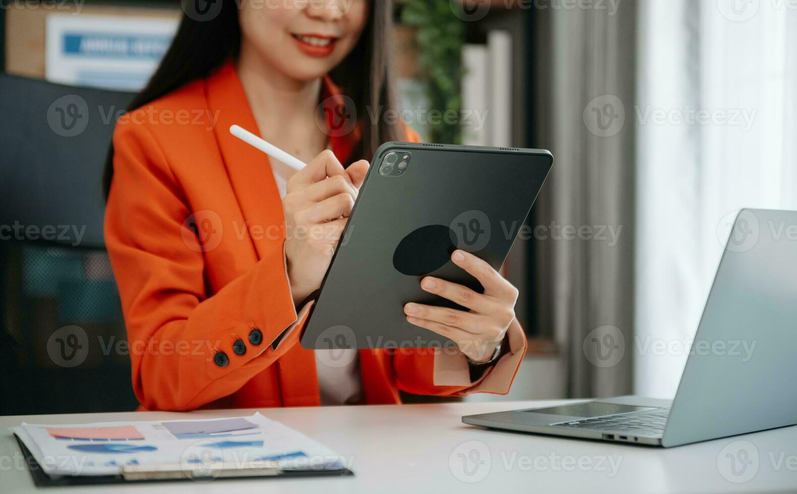 Businesswoman hand using laptop, tablet and smartphone. Digital marketing media mobile app and discussing plan new start up project. Finance task. photo