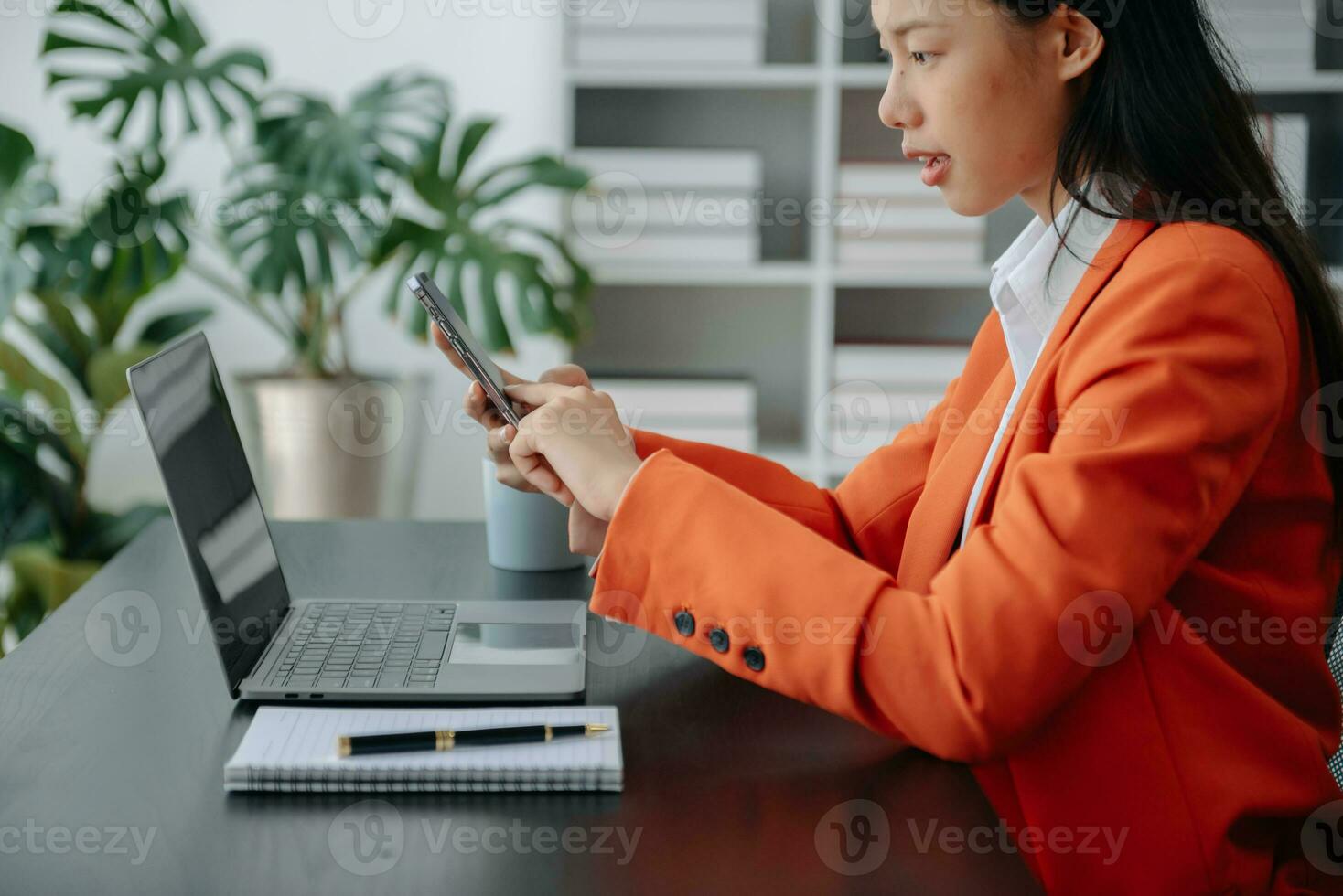 Working Process in Modern Office. Young Woman Account Manager Working at Table with New Business Project. Using Contemporary Laptop. photo