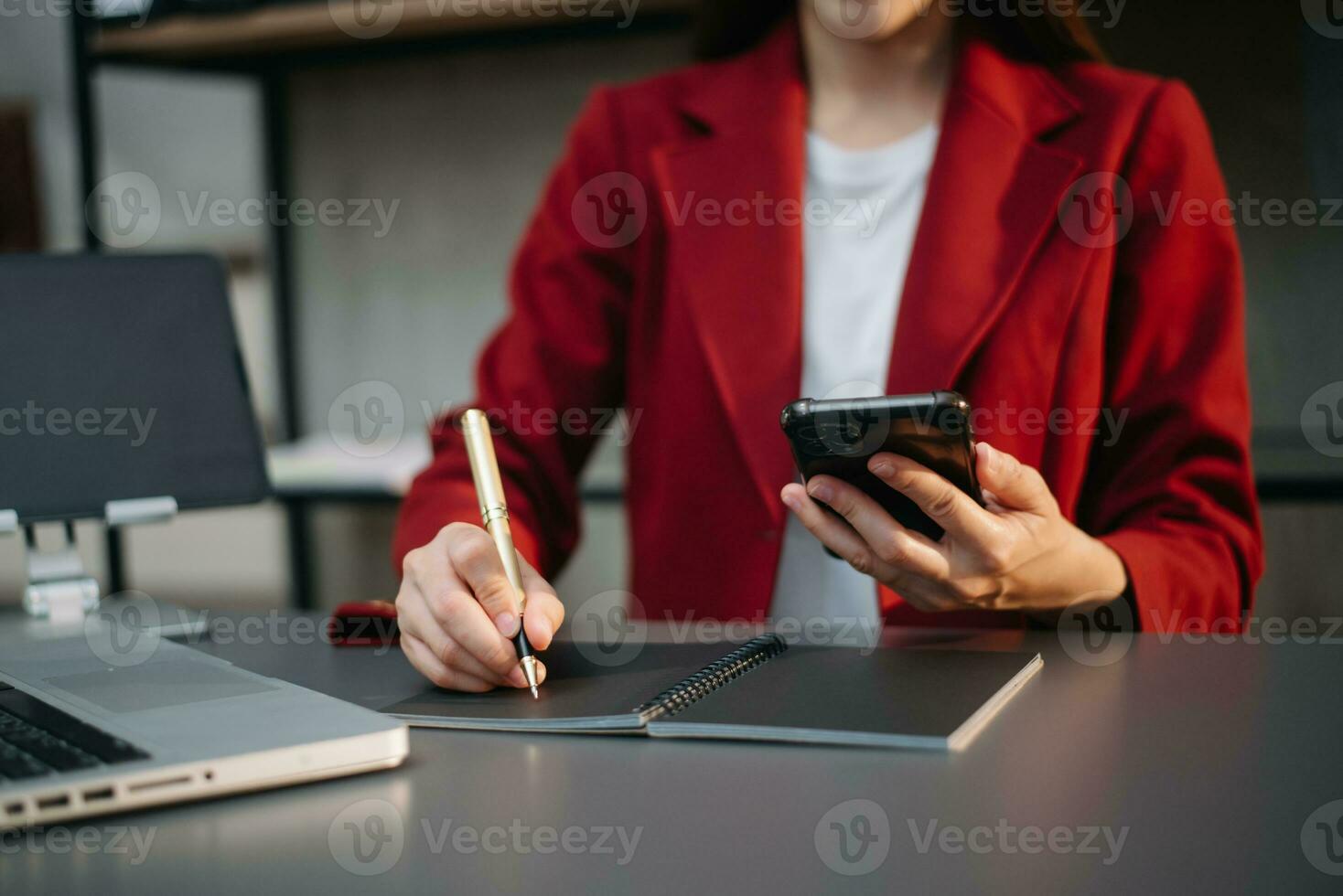 Businesswoman hand using laptop, tablet and smartphone in office. Digital marketing media mobile app and discussing plan new start up project. photo