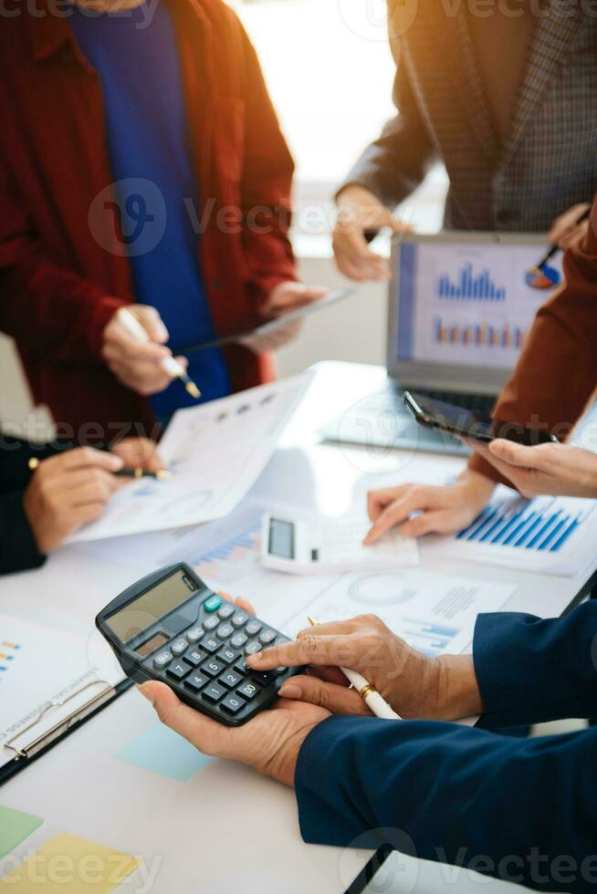 Business people meeting at office writing notes about sticky notes Laptop,tablet  Planning and Brainstorming Strategies of Colleagues photo