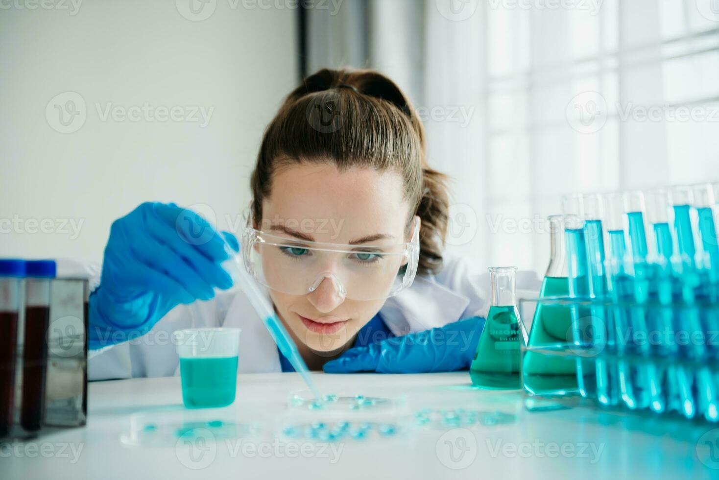 Female biotechnologist testing new chemical substances in a laboratory