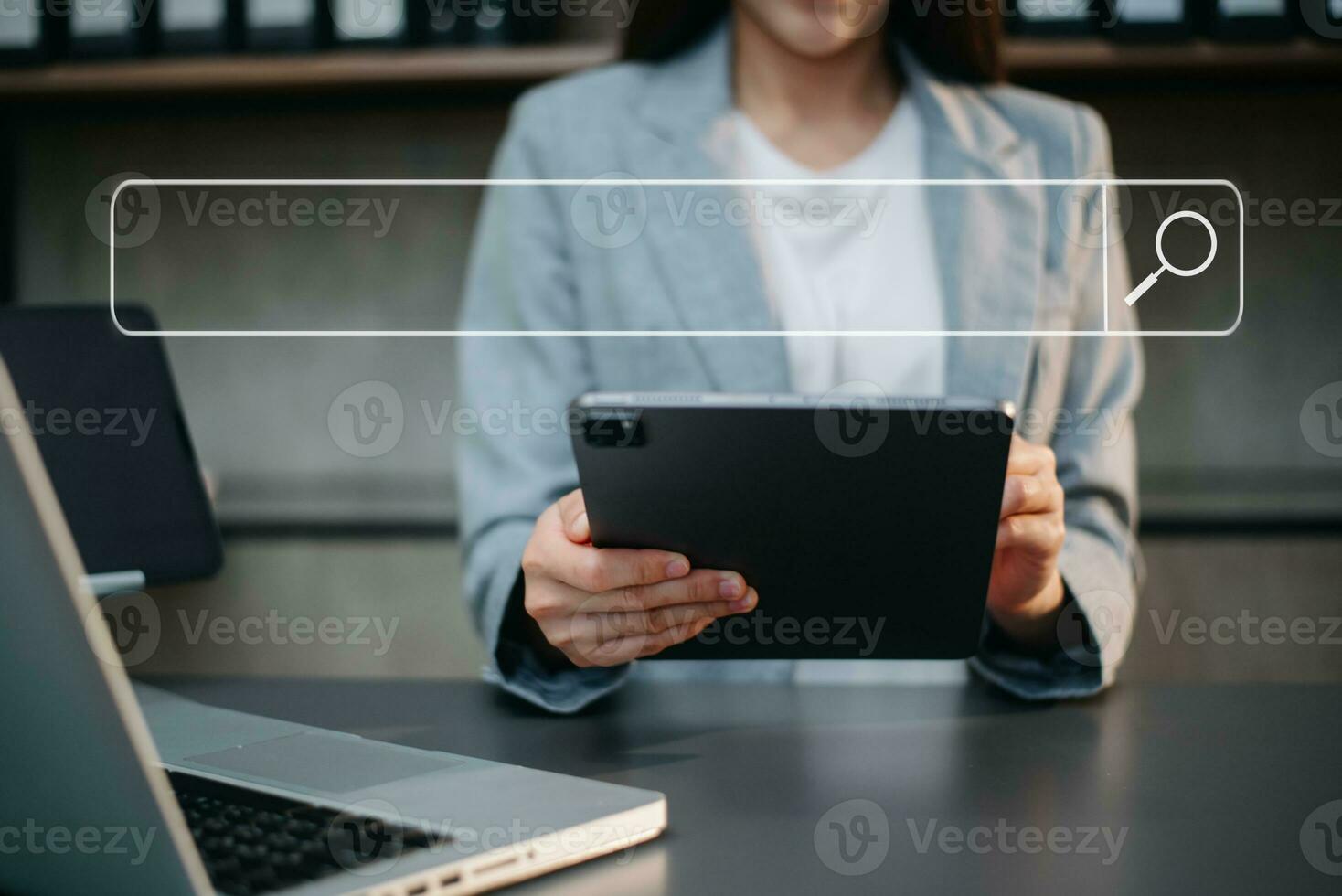 Searching Browsing Internet Data Information Networking Concept with blank search bar. woman working with mobile phone and laptop computer photo