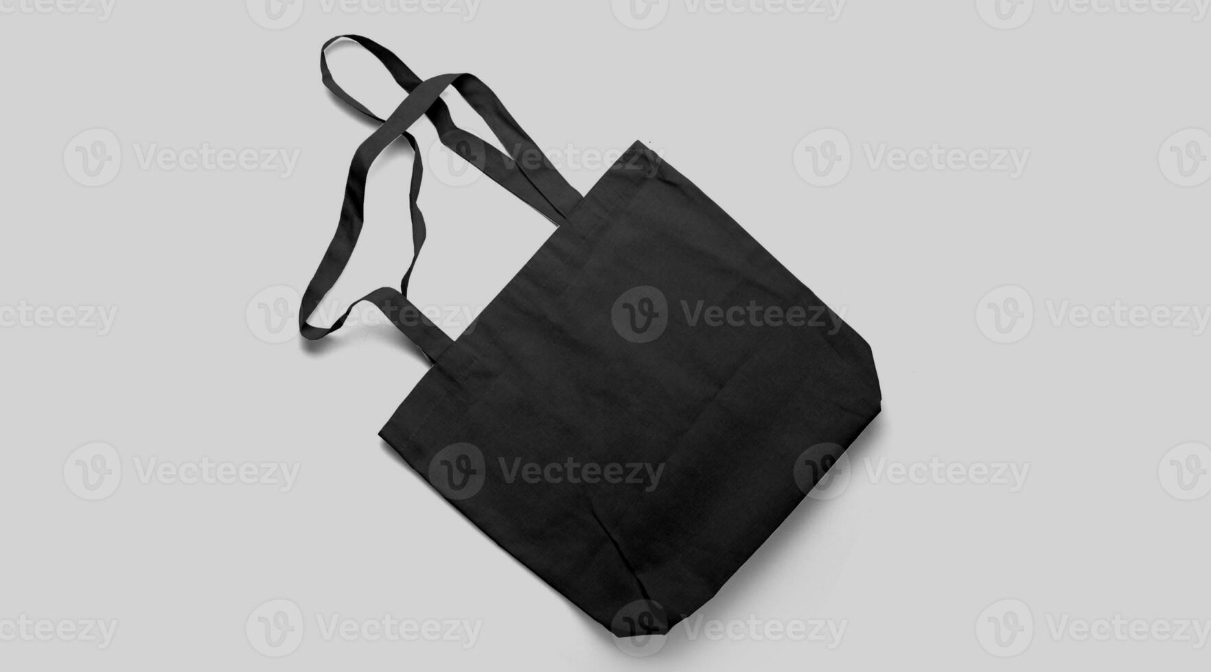 An isolated view of the black Tote bag on an grey background. photo