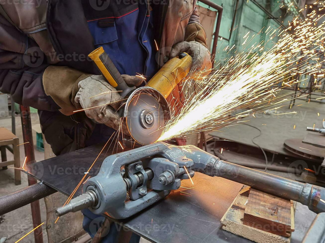 Grinding Work with Smooths Equipment for Steel Metal, Iron, Sparks at Manufacturing Heavy Industry Factory Close Up Indoor. photo