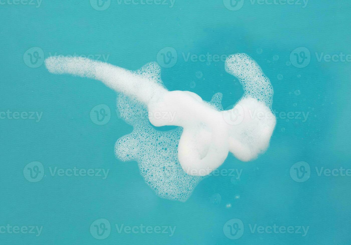 White foam isolated on blue photo