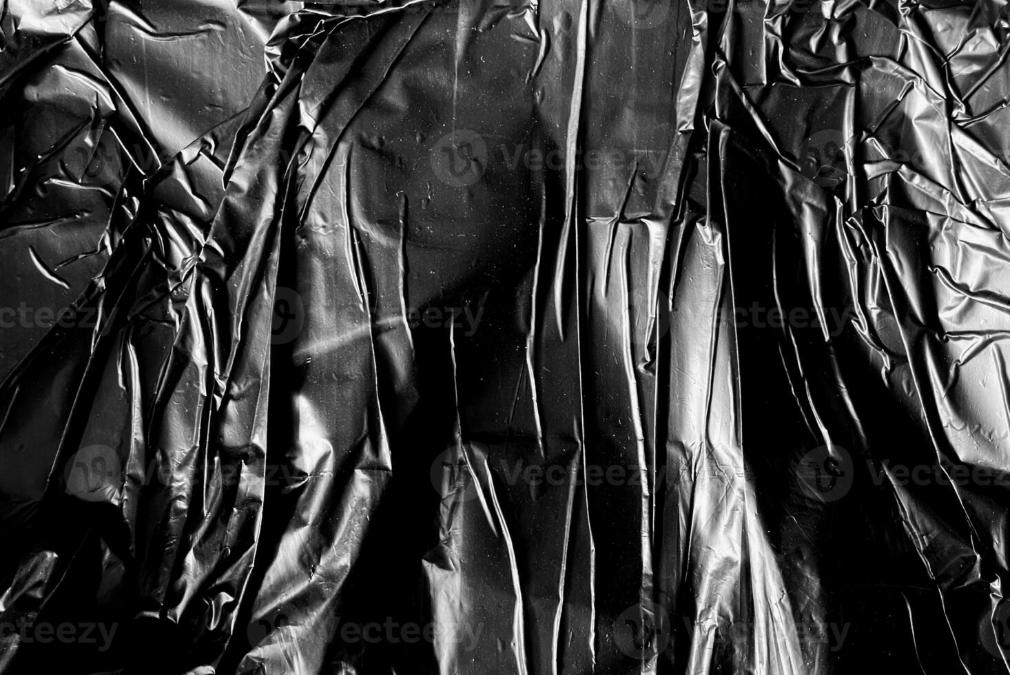 Abstract wrinkled plastic texture background photo