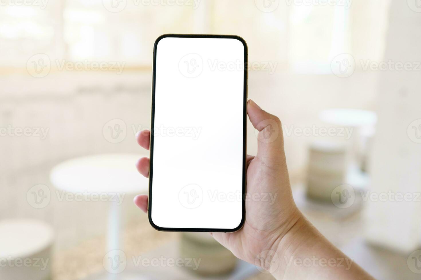 Women's hands holding cell telephone blank copy space screen. smartphone with blank white screen isolated. smart phone with technology concept. photo