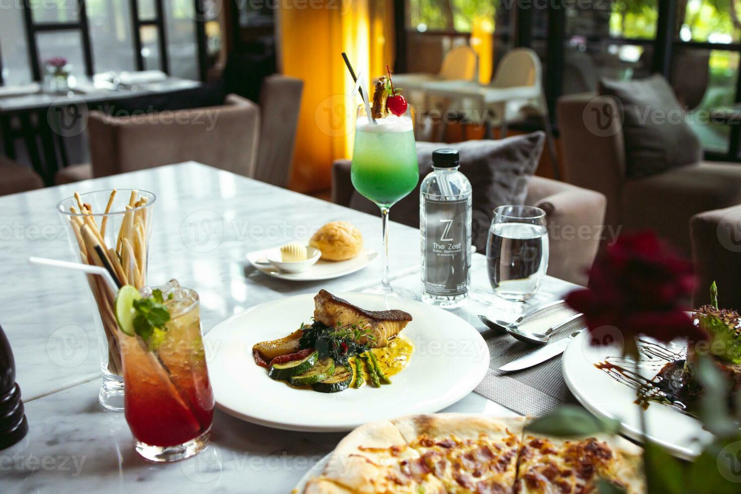 Luxury table settings for fine dining served and decorated table with food for guests in the restaurant photo