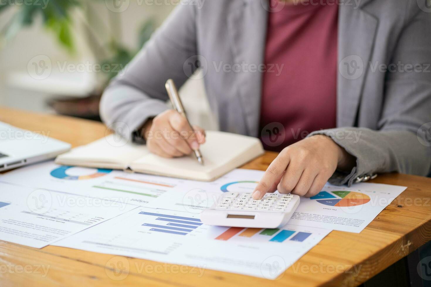 Calculating Cost Economic budget saving and investment concept analyzing investment charts and calculator Accounting Concept photo