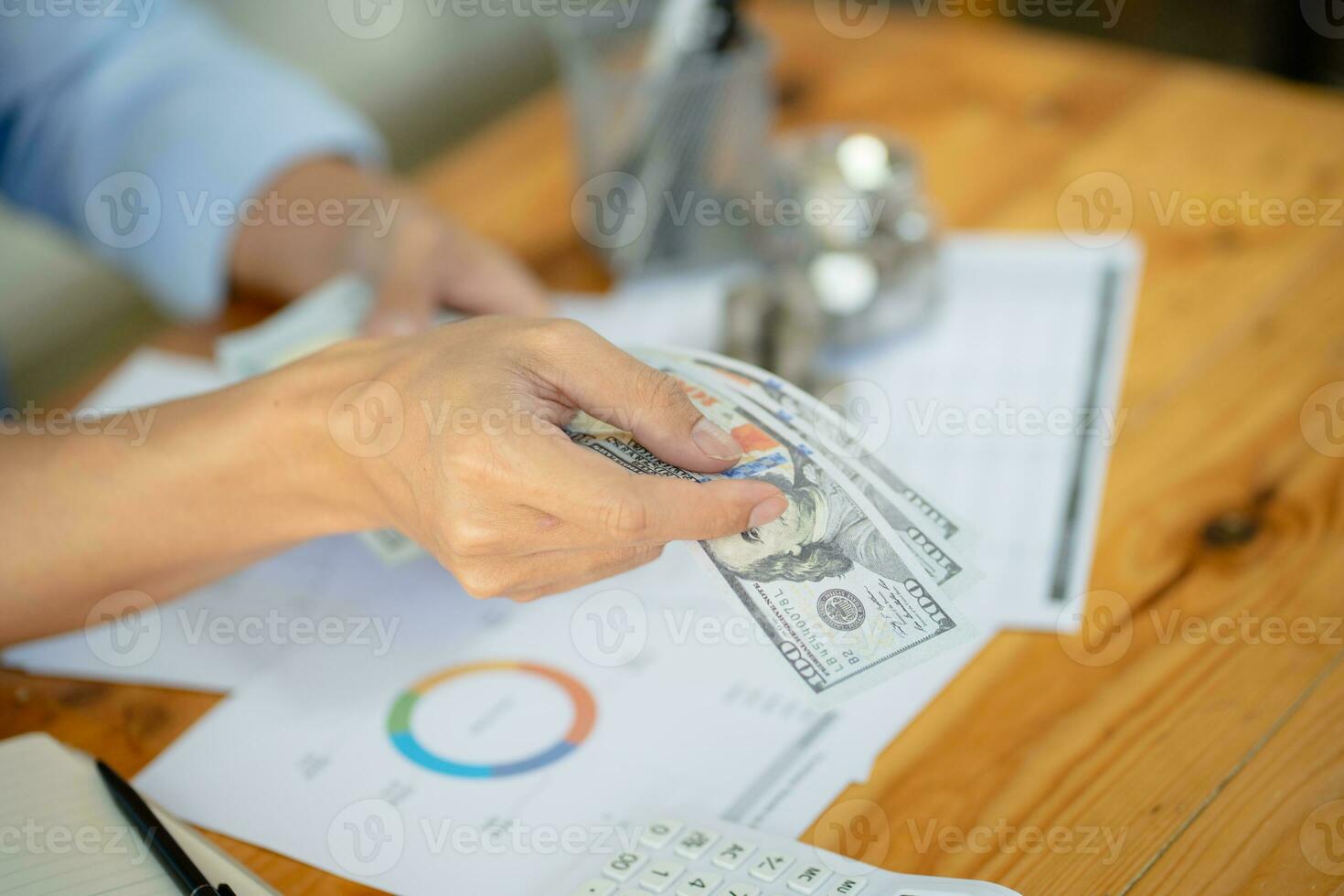 Saving money. Businessman Accountant verify growing business and saving money stacking coins with calculator. Accountancy Concept. photo