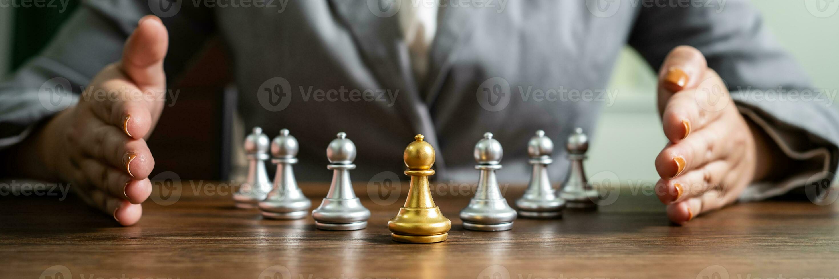 Chess leader and team. Human resources concept career management with clasped hands planning strategy with chess figures. leadership or success teamwork. Inspiration idea of goal photo