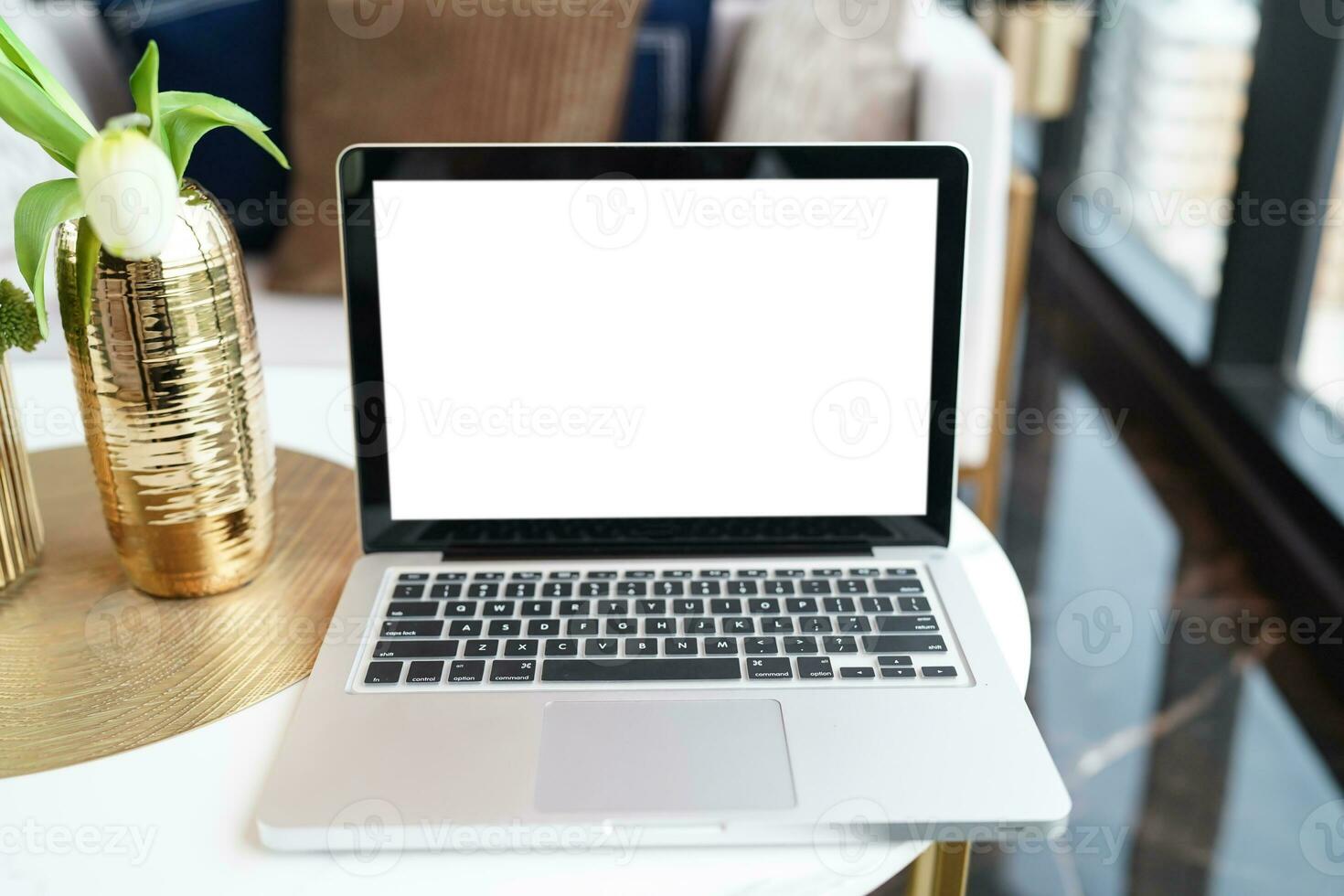 Laptop with Mock up blank screen on table in front of cafe space for text. product display computer laptop montage- technology concept photo