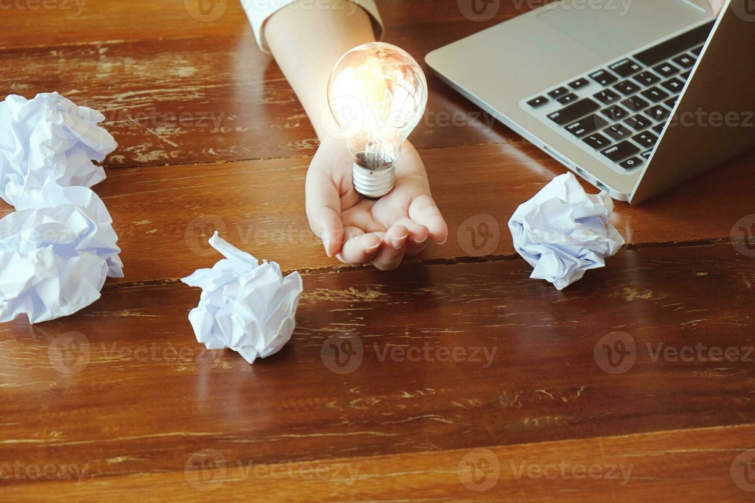 Idea of business person holding light bulb concept creativity with bulbs. photo