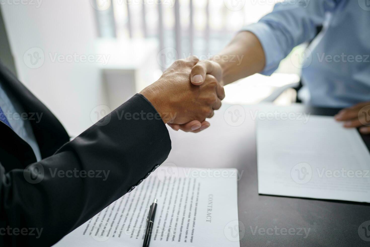 Lawyer Legal counsel Businessman shaking hands successful making a deal. mans handshake. Business partnership meeting concept. photo