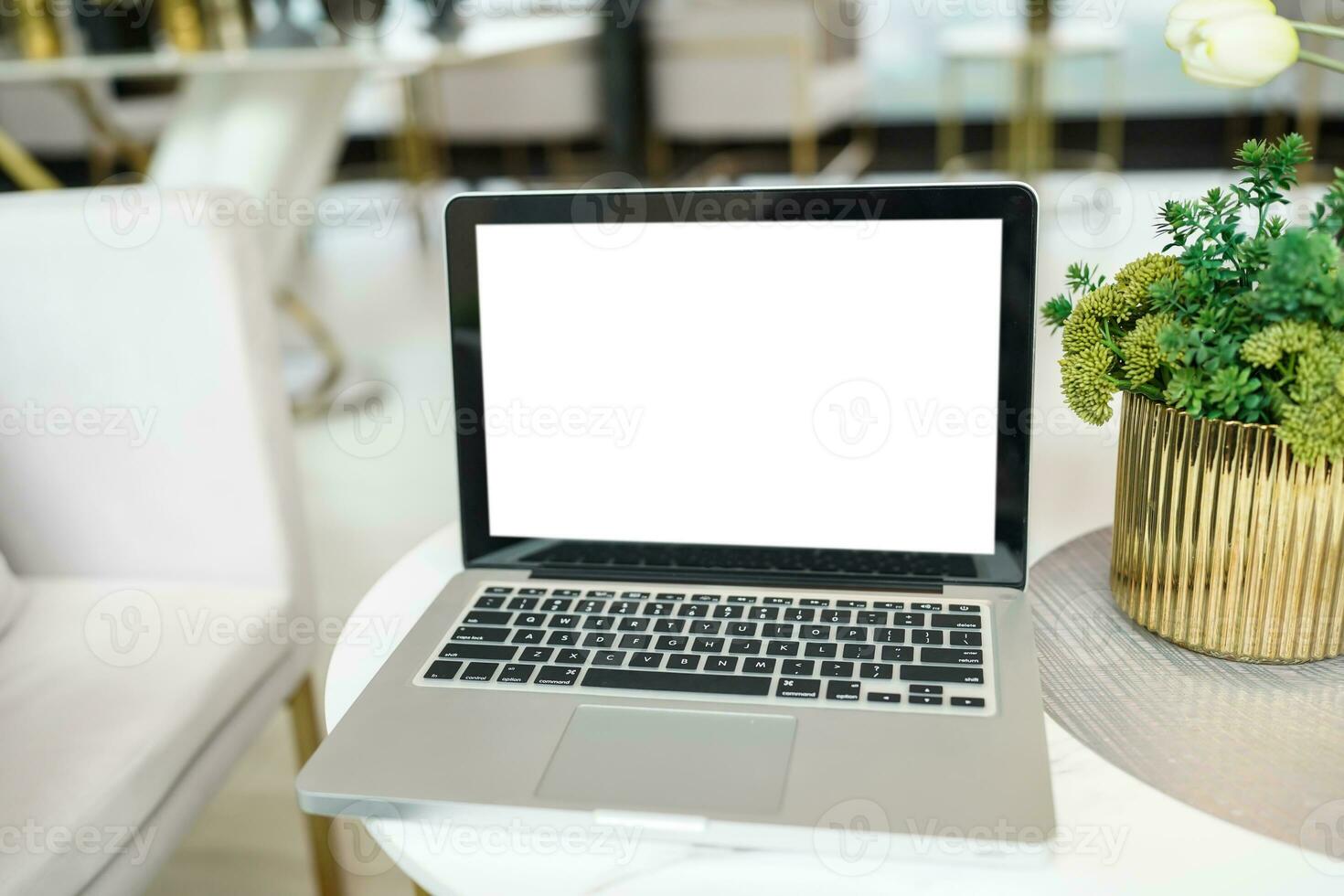 Laptop with Mock up blank screen on table in front of cafe space for text. product display computer laptop montage- technology concept photo