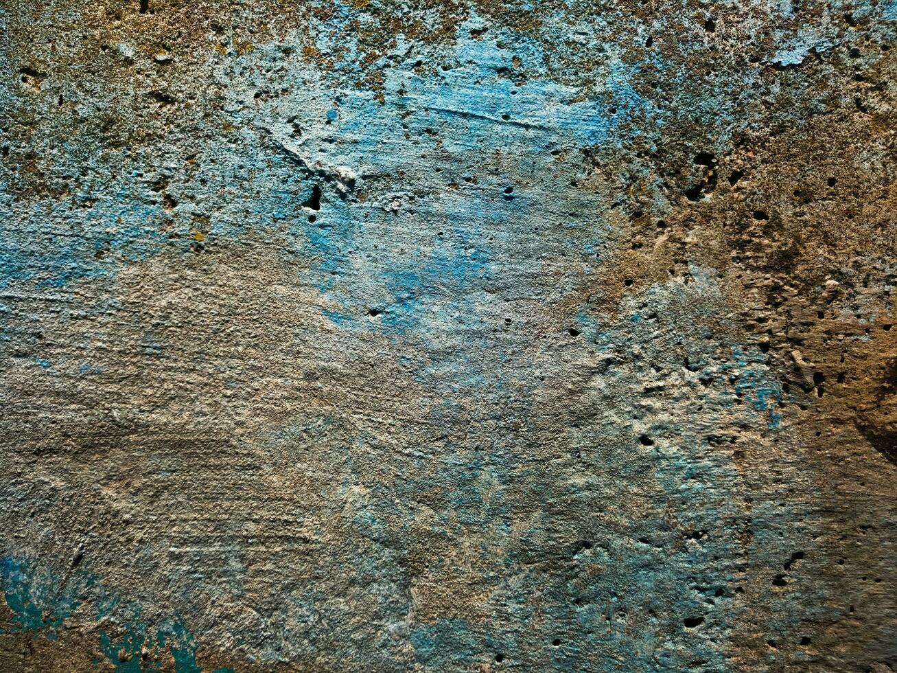 Texture of an old concrete wall, painted over with strokes of blue and light brown paint for a background in a loft style, for your design. Photo. photo