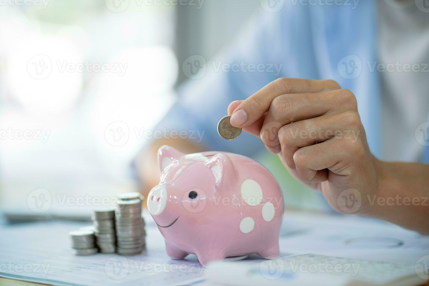 Saving money. Businessman Accountant verify growing business and saving money stacking coins with calculator. Accountancy Concept. photo