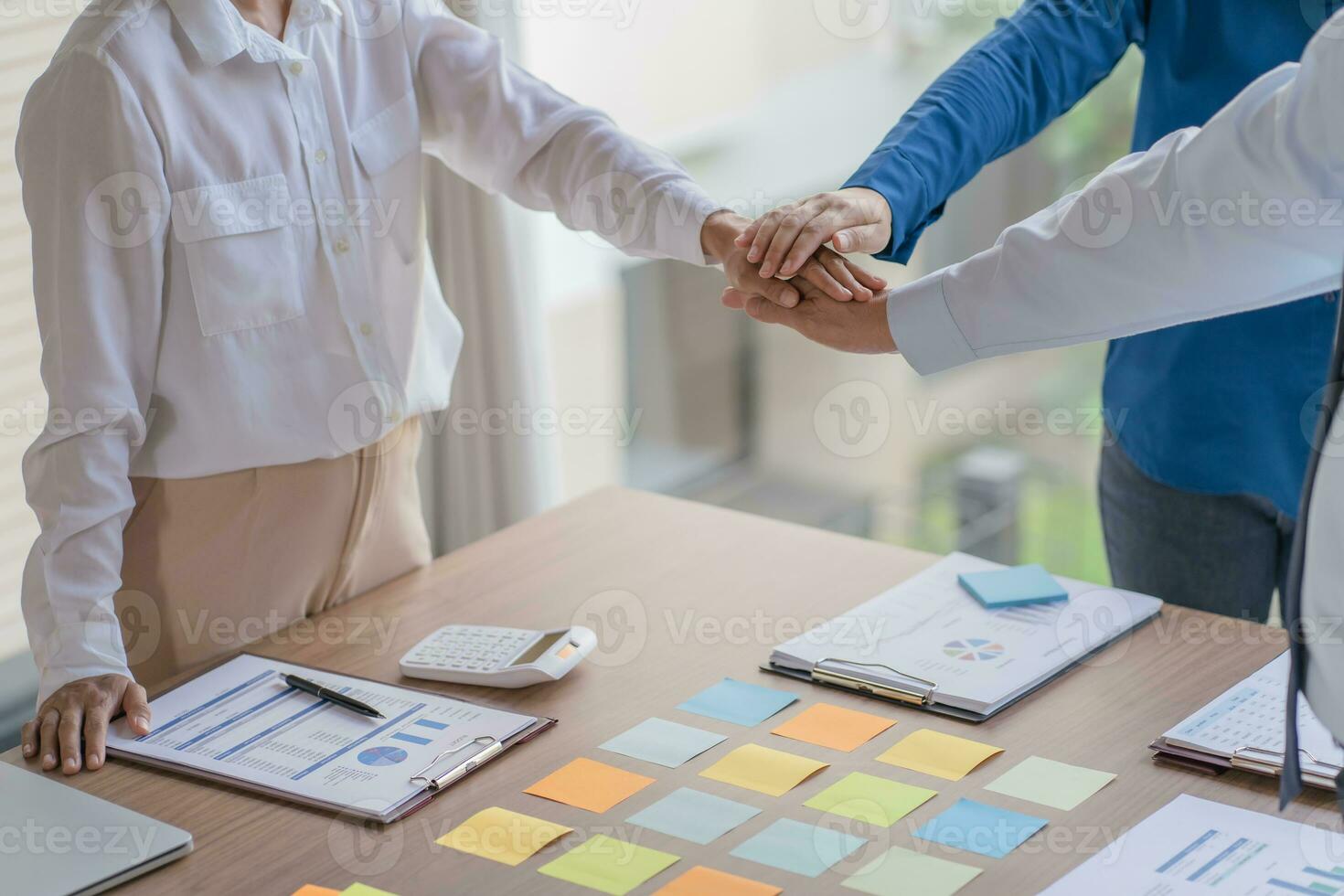 Business partnership putting hands together team start up project business people join hands partnership Unity and teamwork. photo