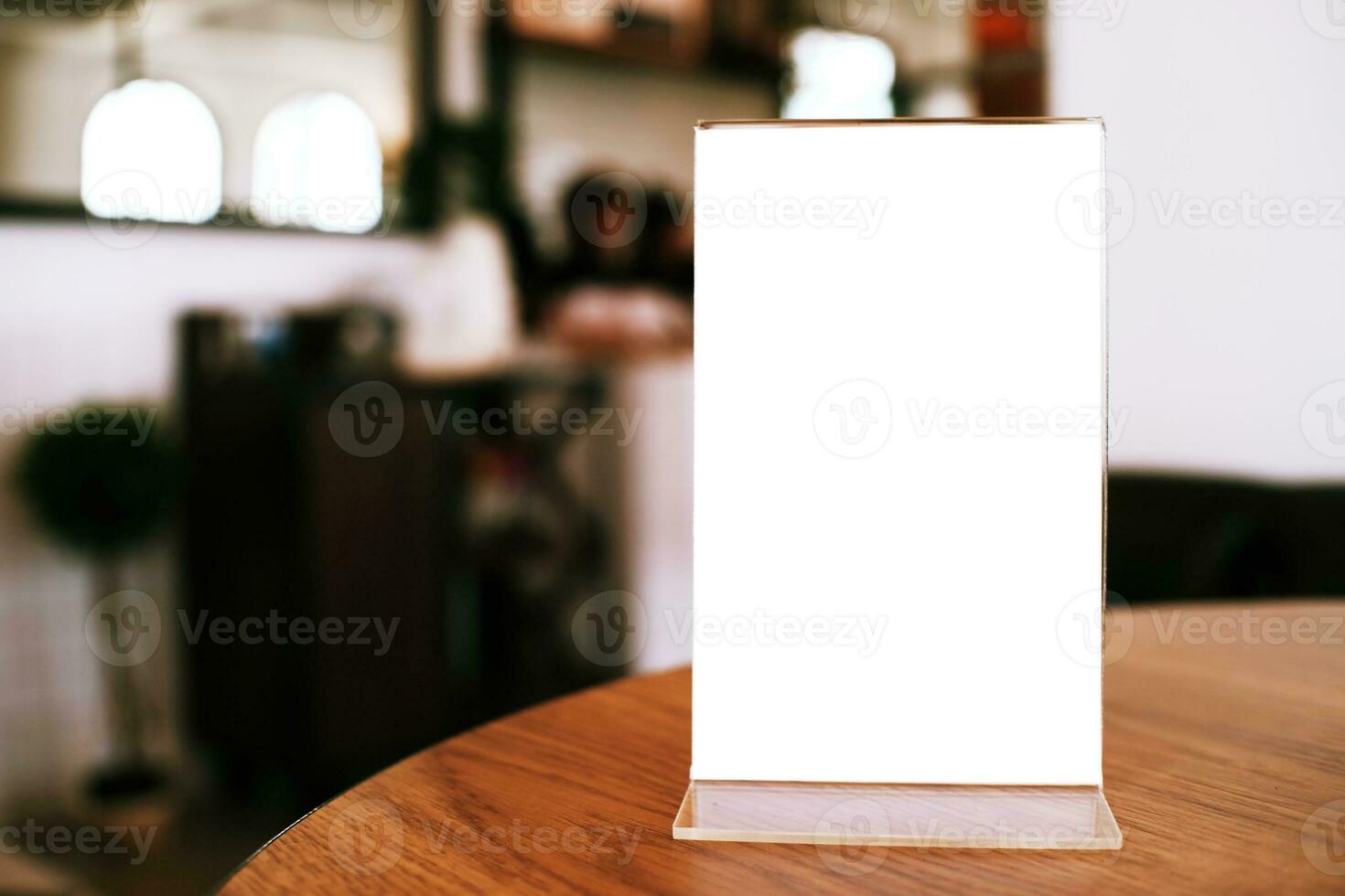 Menu frame standing on wood table in Bar restaurant cafe. space for text marketing promotion. photo