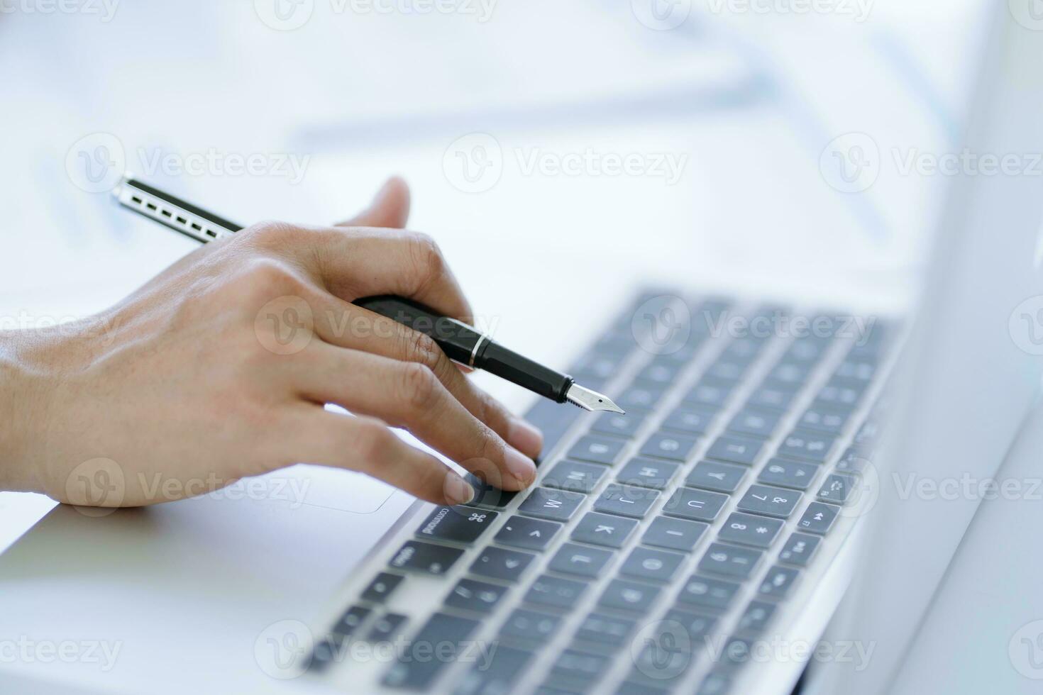 Business man working using laptop computer Hands typing keyboard. Professional investor working start up project. business planning in office. Technology business Concept photo