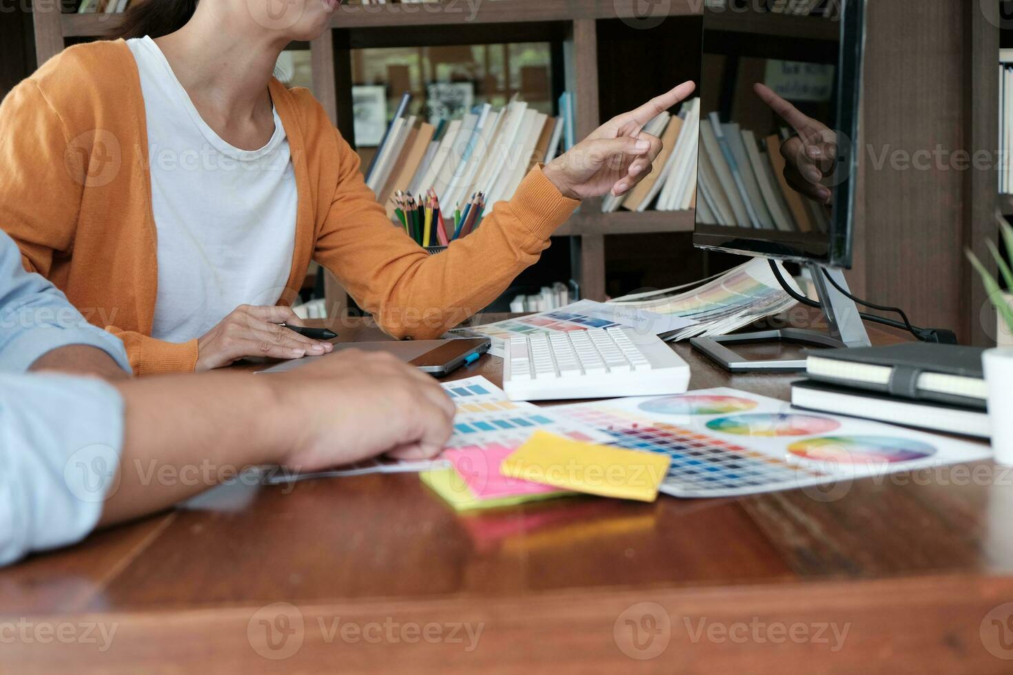 Graphic designer working on digital tablet. artist drawing on graphic tablet and Color swatch samples. photo