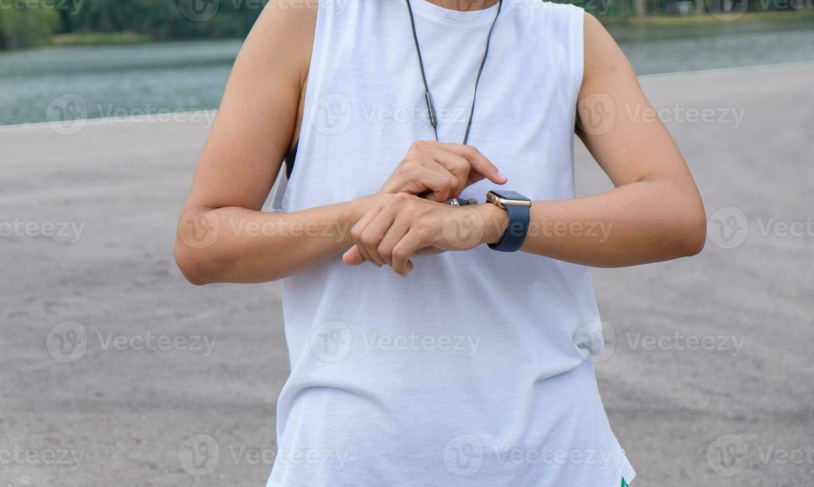 woman measuring smart watch with heart rate after running, health apps concept. photo