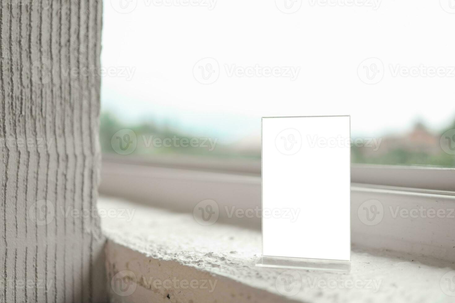 Mock up Menu frame standing on wood table in Bar restaurant cafe. space for text. photo