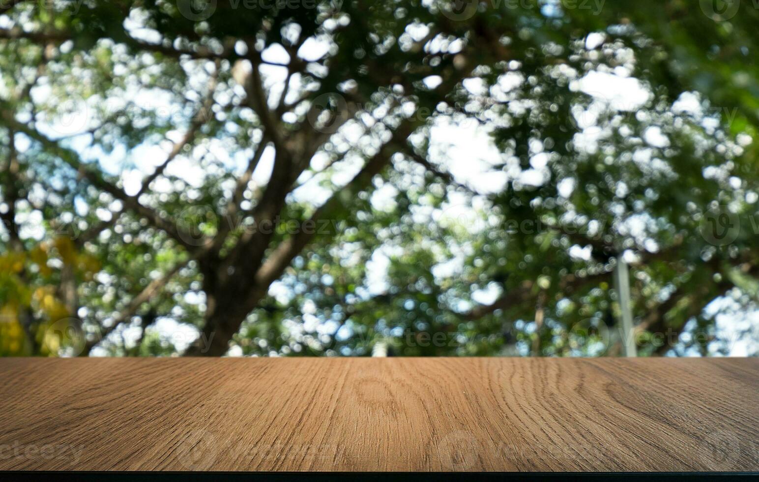 Wood Table Top in Blur Background room interior with empty copy space. photo