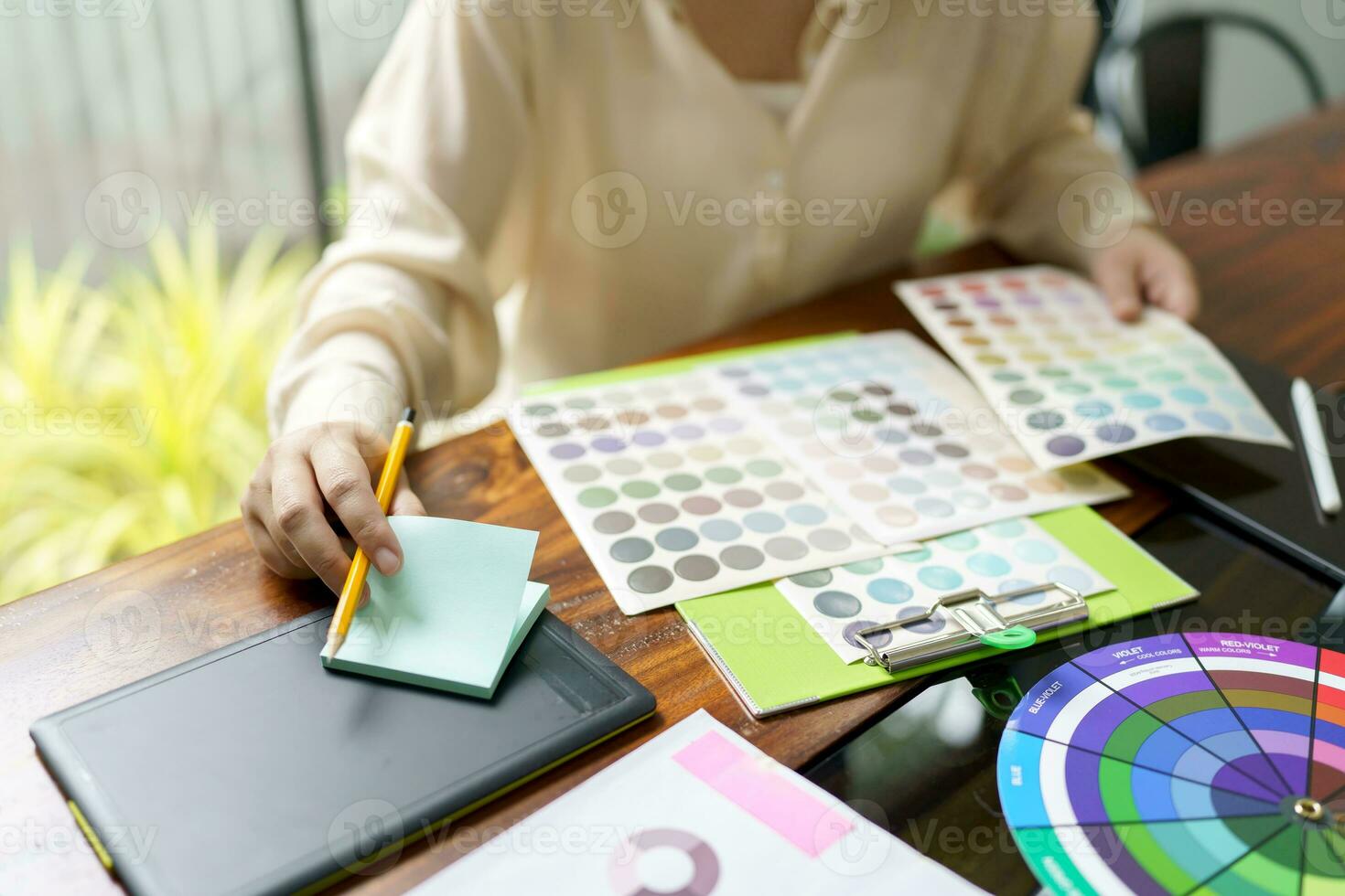 Creative idea Business female Artist Creative Designer sketch graphic drawing on graphic tablet and Color swatch samples Concept of idea creativity. photo