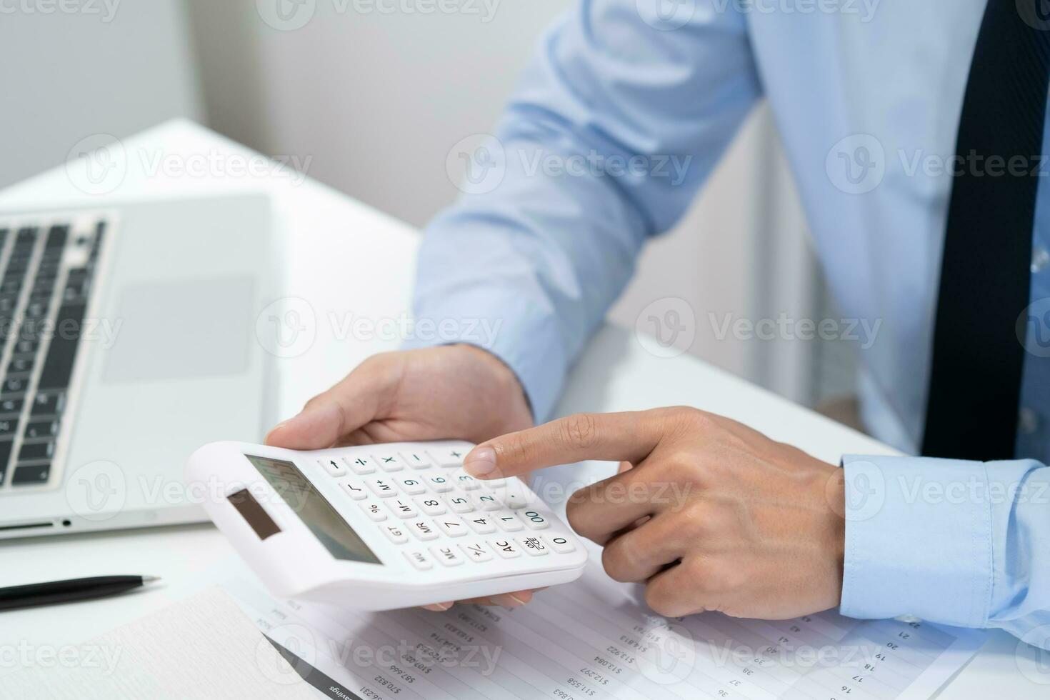 Saving money. Businessman Accountant verify growing business and saving money stacking coins with calculator. Accountancy Concept. photo