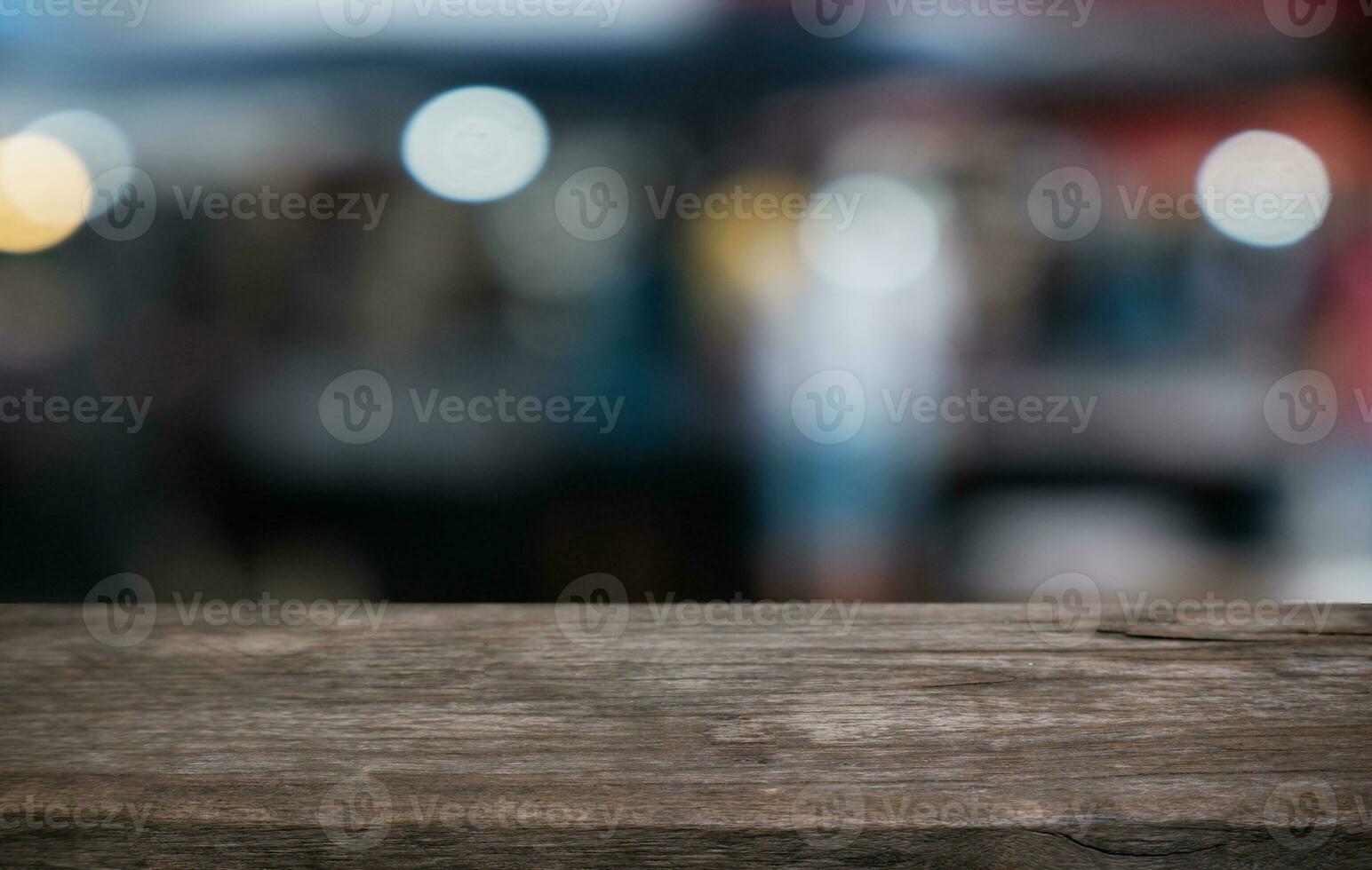 Wood Table Top in Blur Background room interior with empty copy space. photo