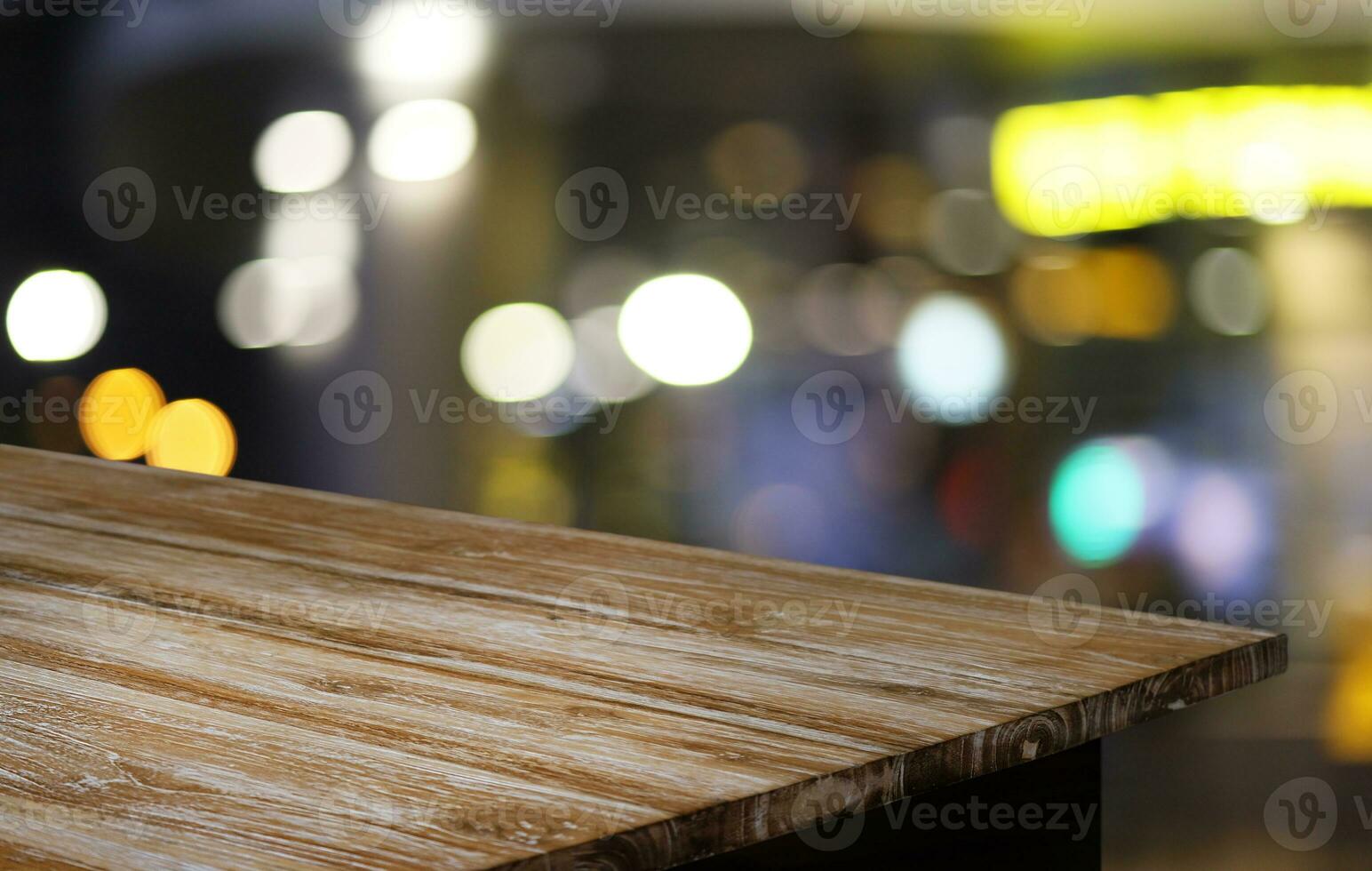 Wood Table Top in Blur Background room interior with empty copy space. photo