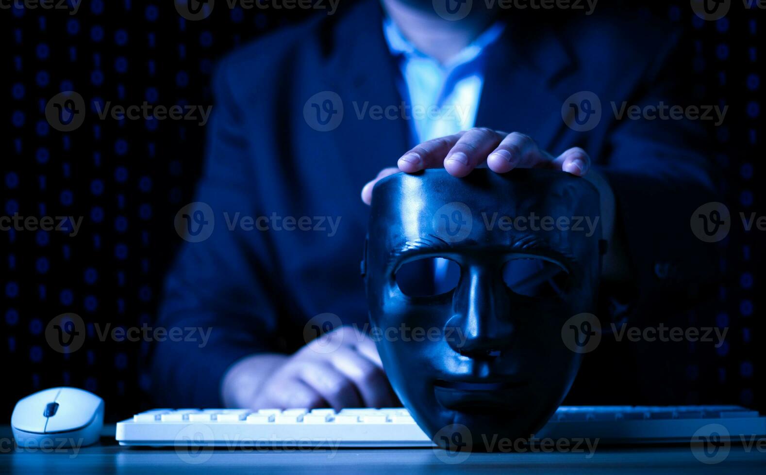 Hacking and malware concept, Hacker using abstract laptop with binary code digital interface, man holding a black mask. photo