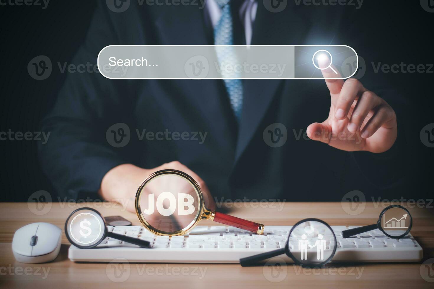 businessman using magnifying glass and computer keyboard to Searching for information. Job search, find a job, unemployment, recruitment, Data Search Technology Search Engine Optimization. photo