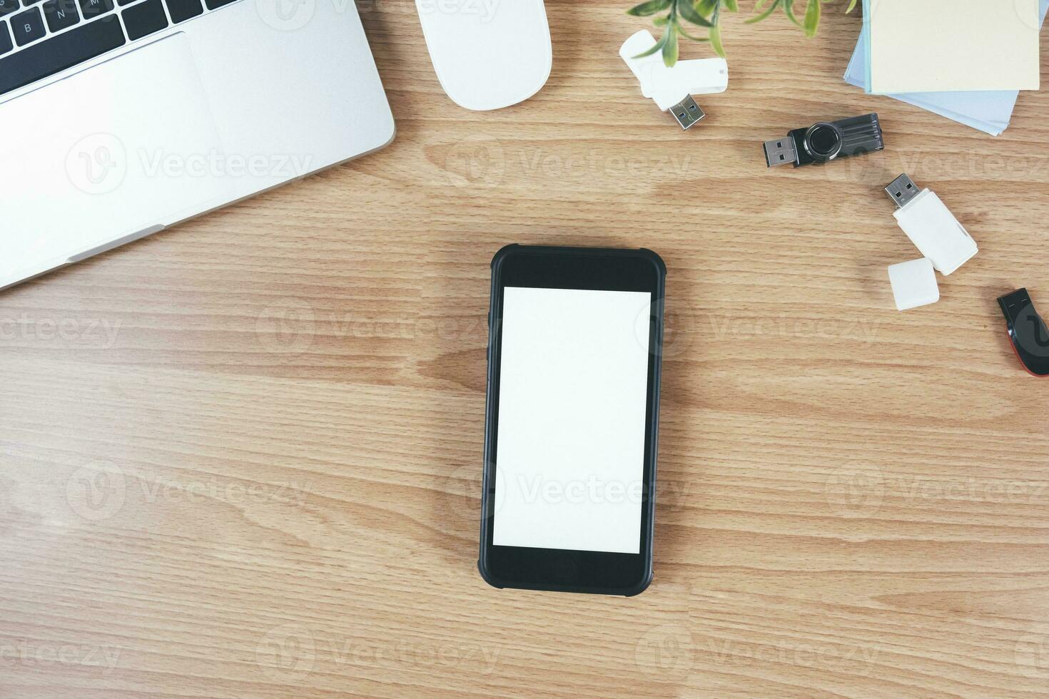 Top view of designer workplace with mock up smartphone on table. photo