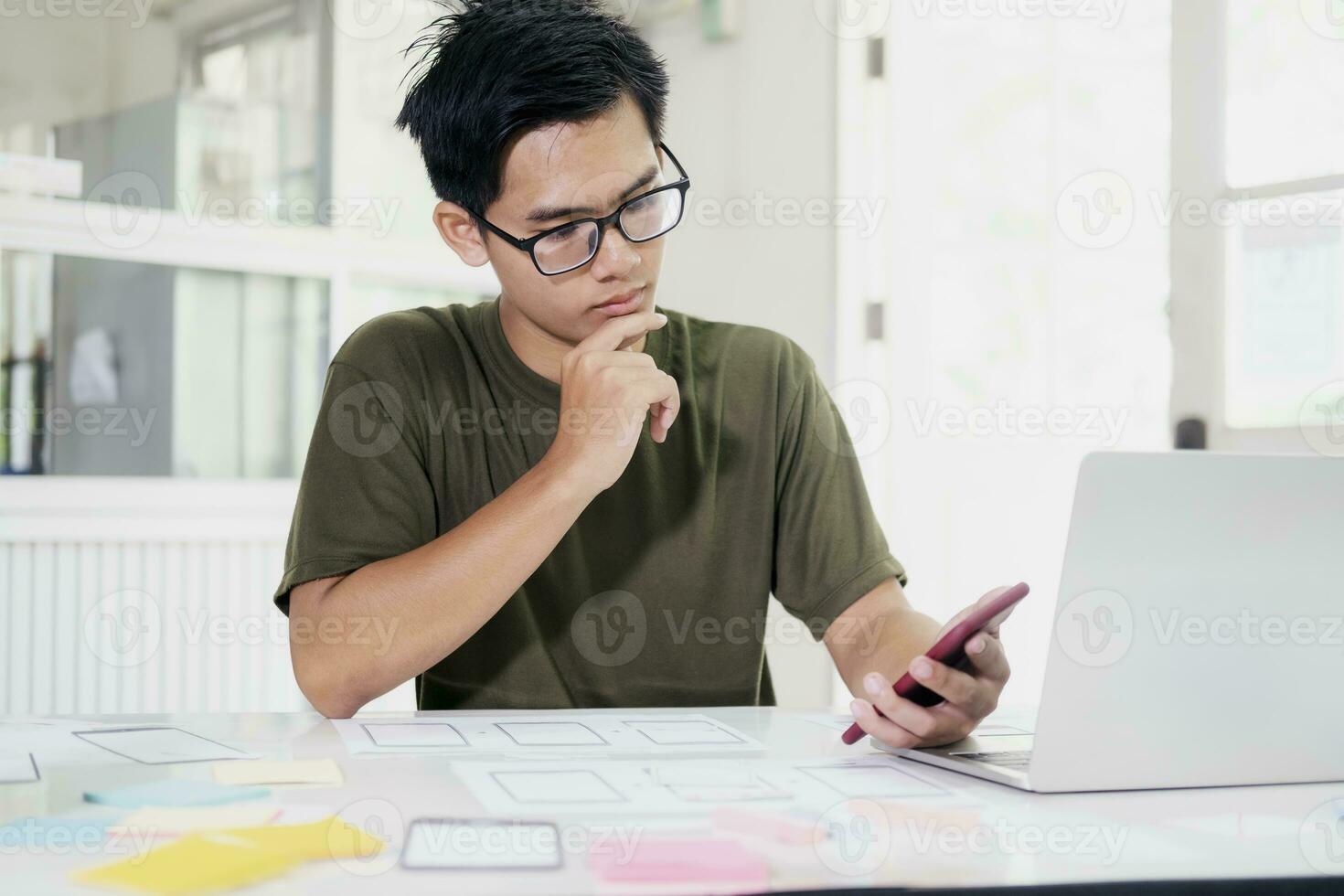 Web designer, UX UI designer designing mobile application user interface. photo