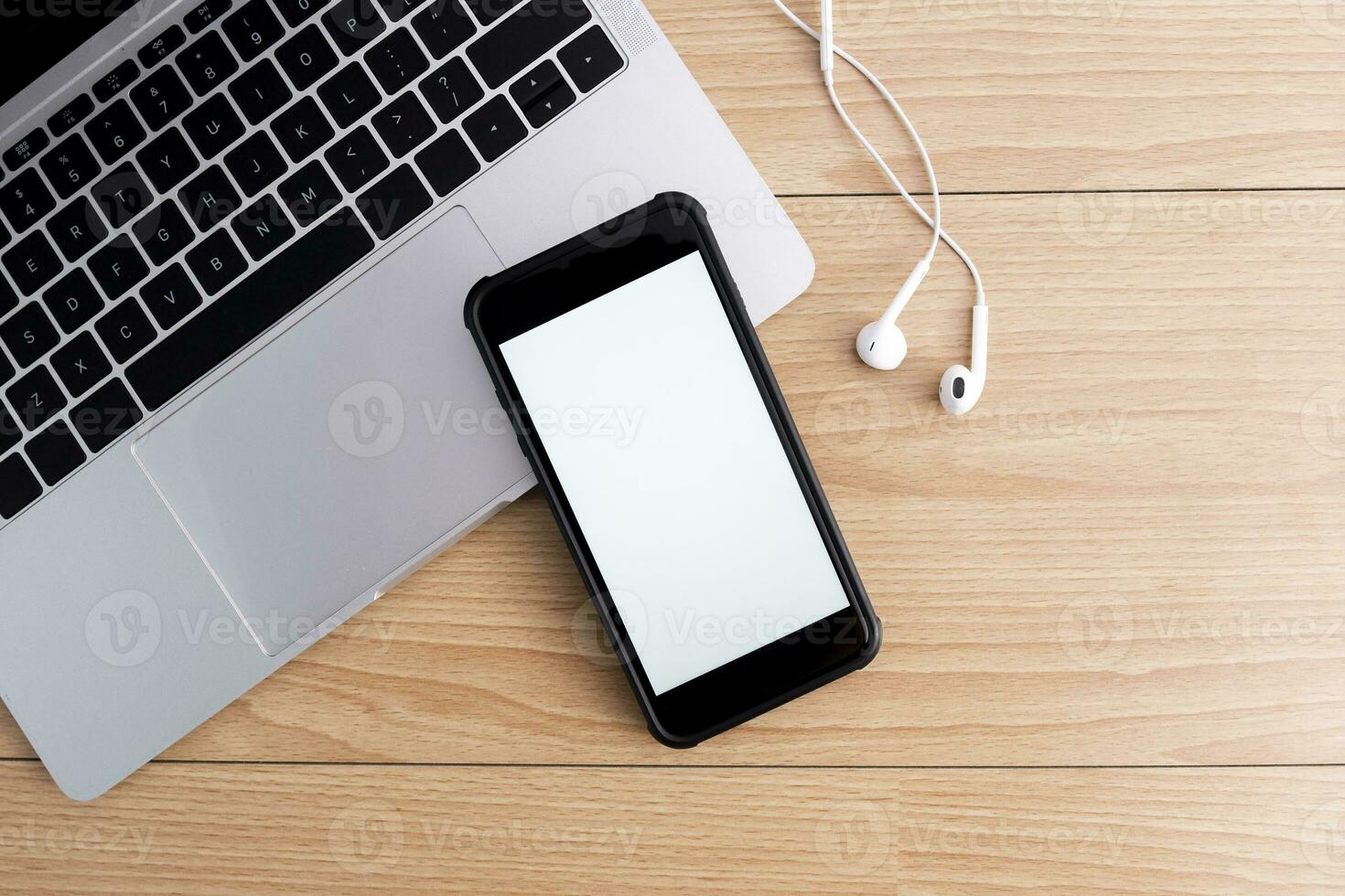 Top view of designer workplace with mock up smartphone on table. photo