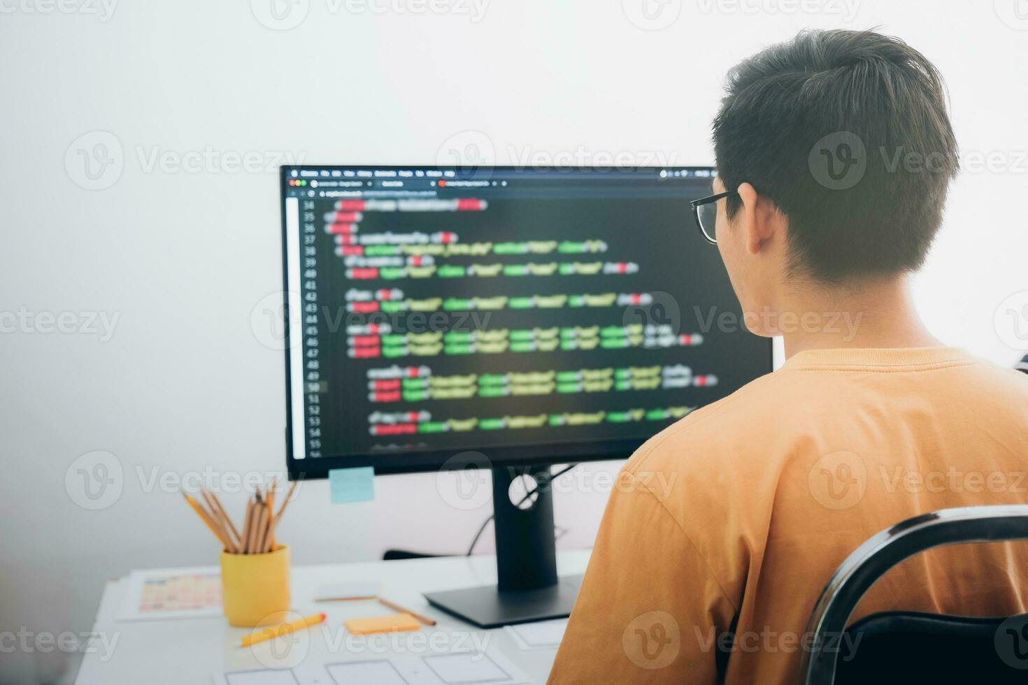 Programmers and developer teams are coding and developing software photo