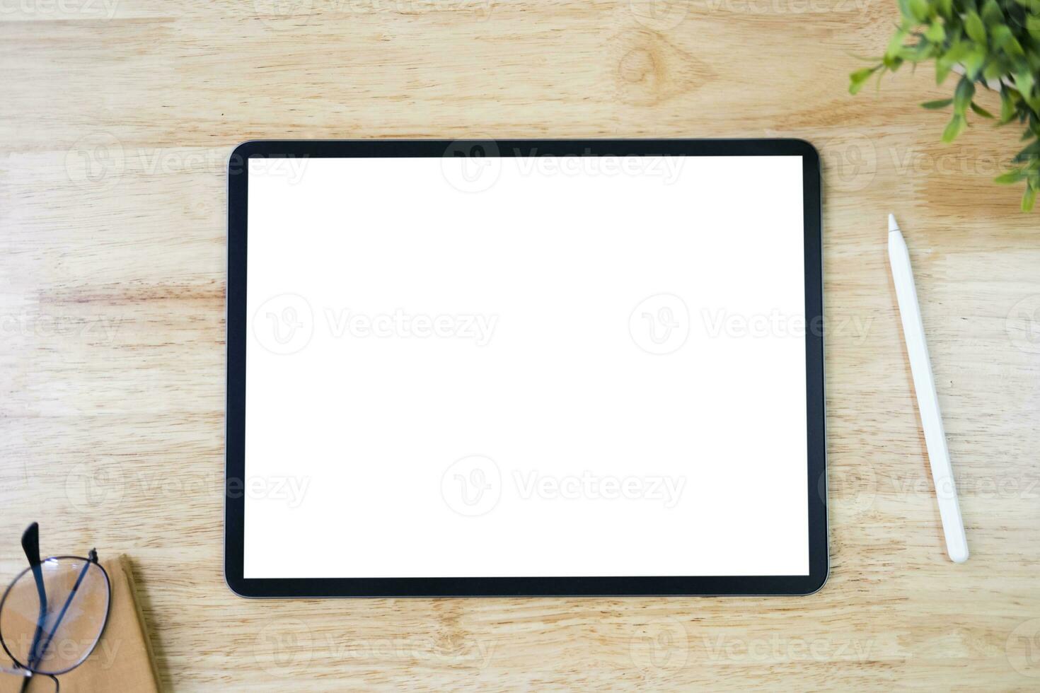 Digital tablet mockup on office working table photo