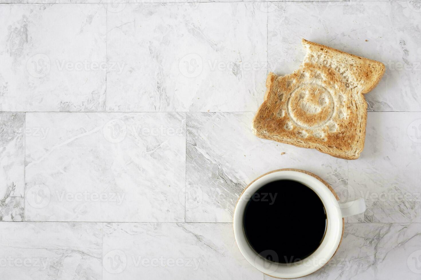 Topview flat lay of working table with coffee and toast bread. photo