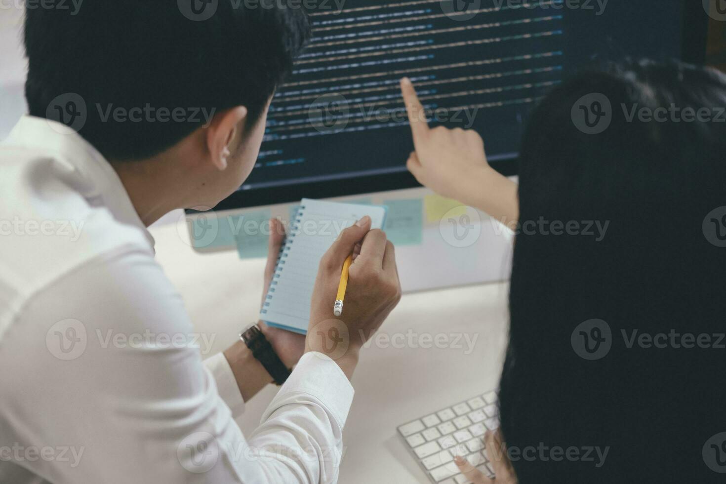 Software developer team working on new computer software project photo