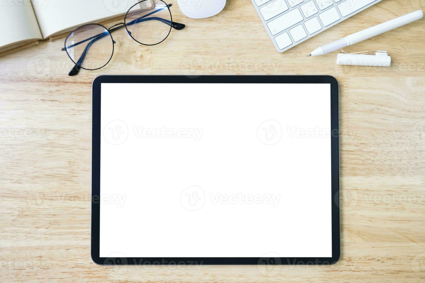 Digital tablet mockup on office working table photo