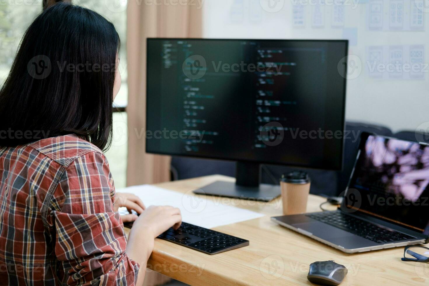 Programmers and developer teams are coding and developing software photo