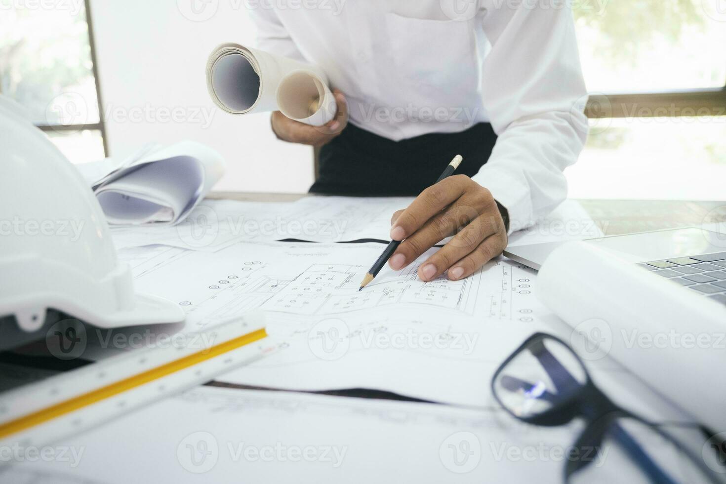 Architect or engineer working in office photo