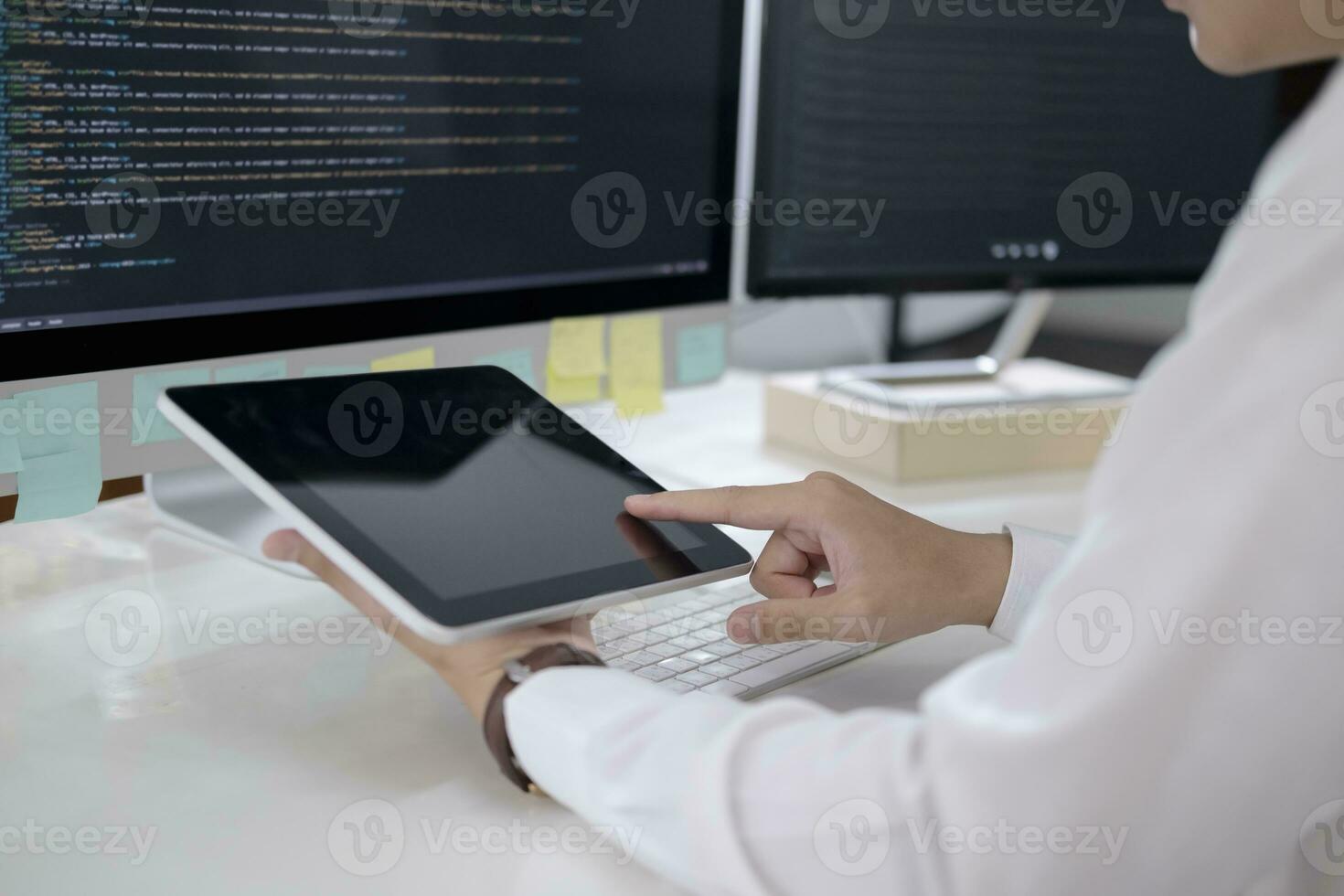 Programmer is coding and programming software photo