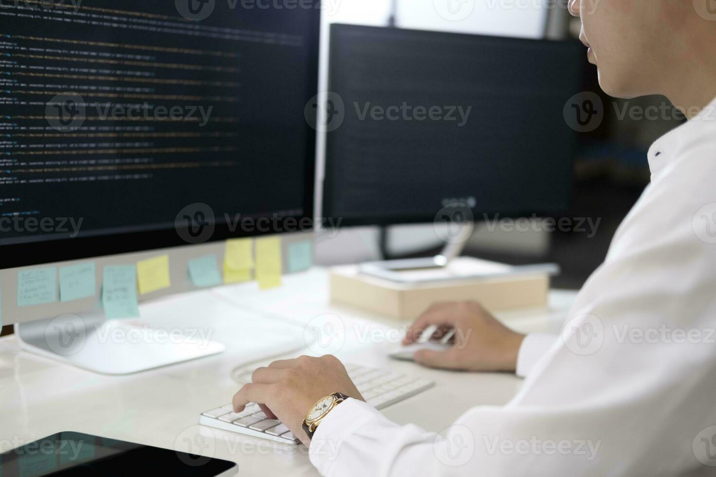 Programmer is coding and programming software photo