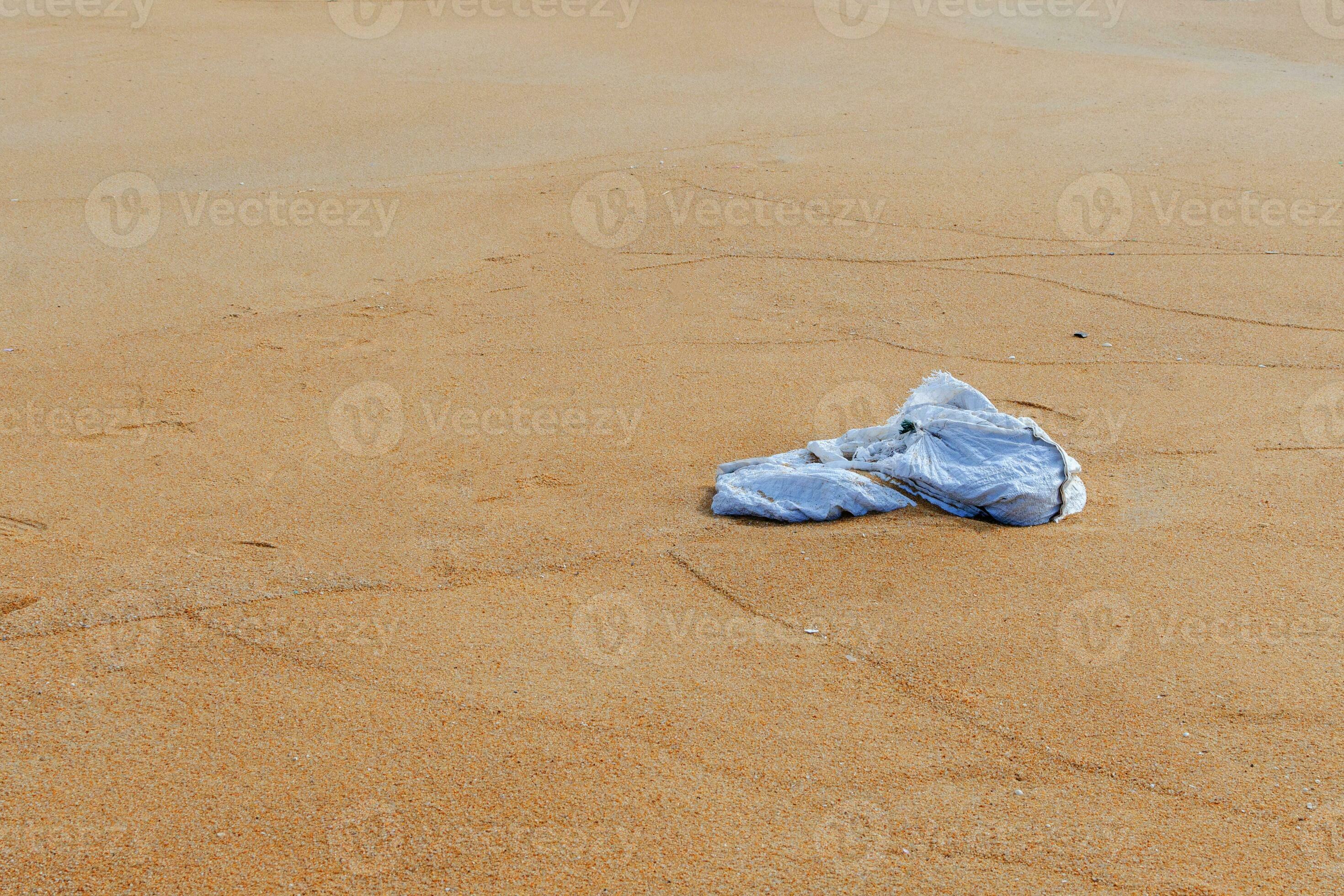 Plastic bag are left on the beach as waste polluting nature, Plastic is