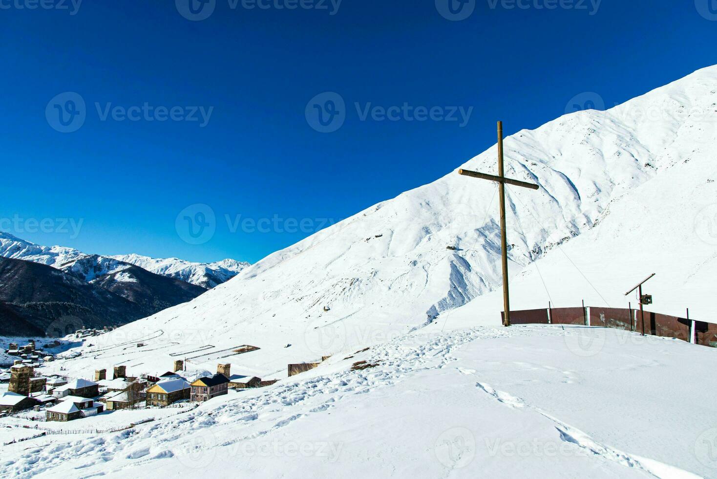 Small village in winter with Caucasus mountain. Ushguli famous landmark in Svaneti Georgia is one of the highest settlements in Europe. photo