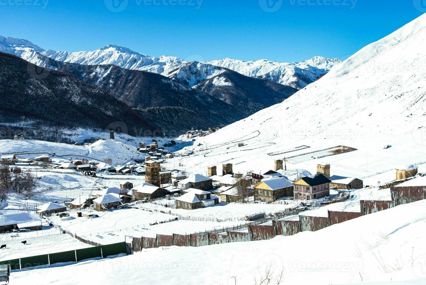 Small village in winter with Caucasus mountain. Ushguli famous landmark in Svaneti Georgia is one of the highest settlements in Europe. photo