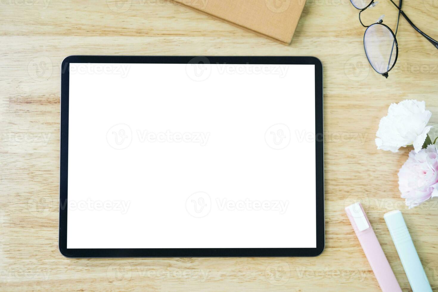 Digital tablet mockup on office working table photo